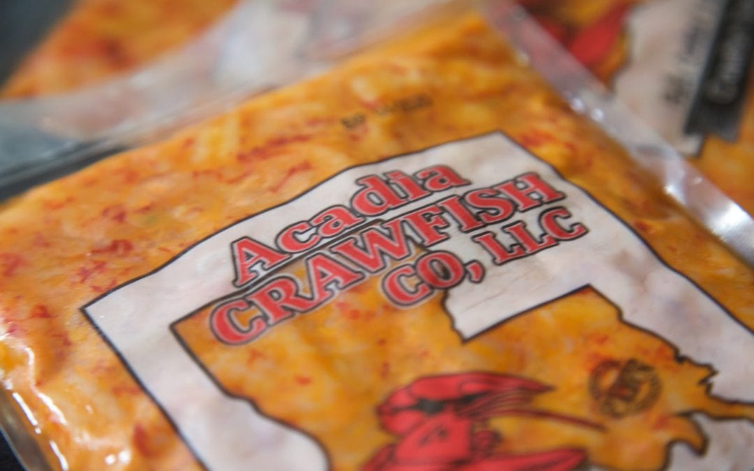 close up image of pack of acadia crawfish frozen crawfish tails